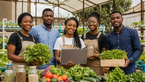 Jeunes entrepreneurs africains de l'agribusiness avec leurs produits et un ordinateur portable